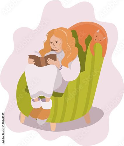 The girl with red hair in home clothes sitting in a cozy green chair.