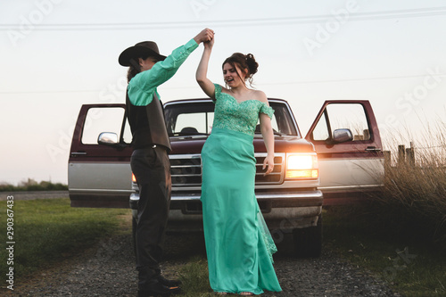 teenage couple having fun on way to high school prom