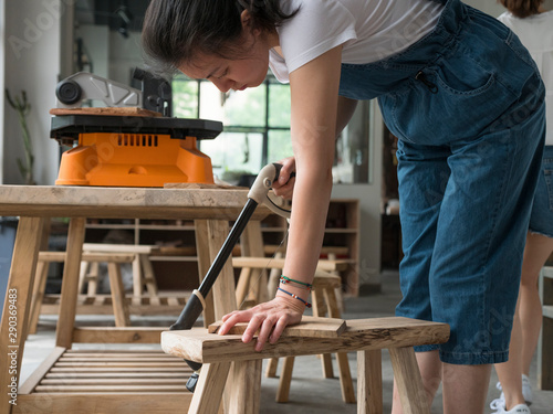 Female Carpenter working in the studio photo