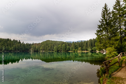 Beautiful and colorful Alpine Lake in Nother Italy in cloudy day. Alps region of Italy