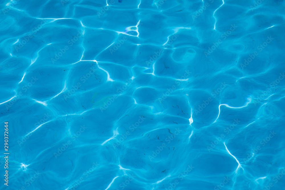blue water of a swimming pool. Summer time image