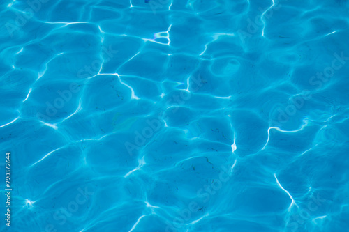 blue water of a swimming pool. Summer time image