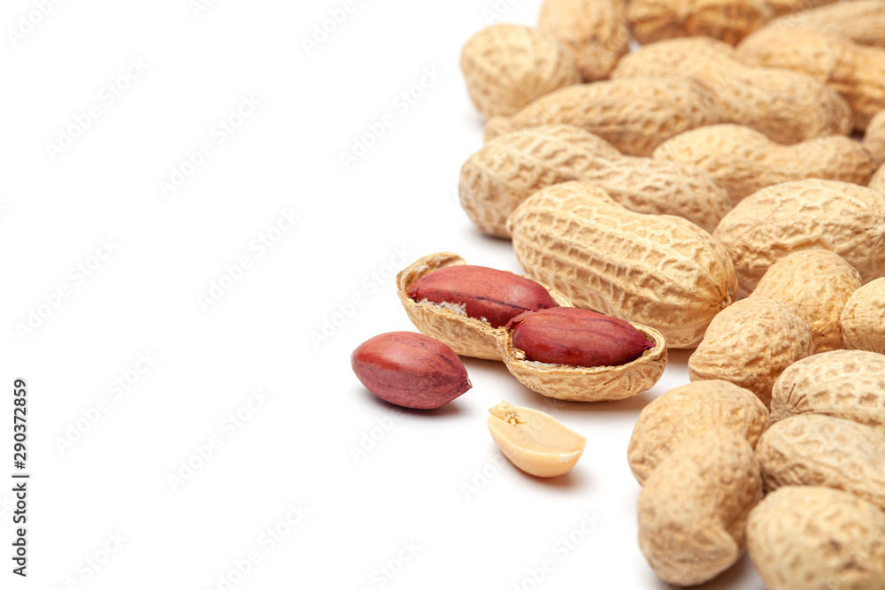 Dried peanuts in peel closeup isolated on white background Dried peanuts in peel closeup isolated on white background