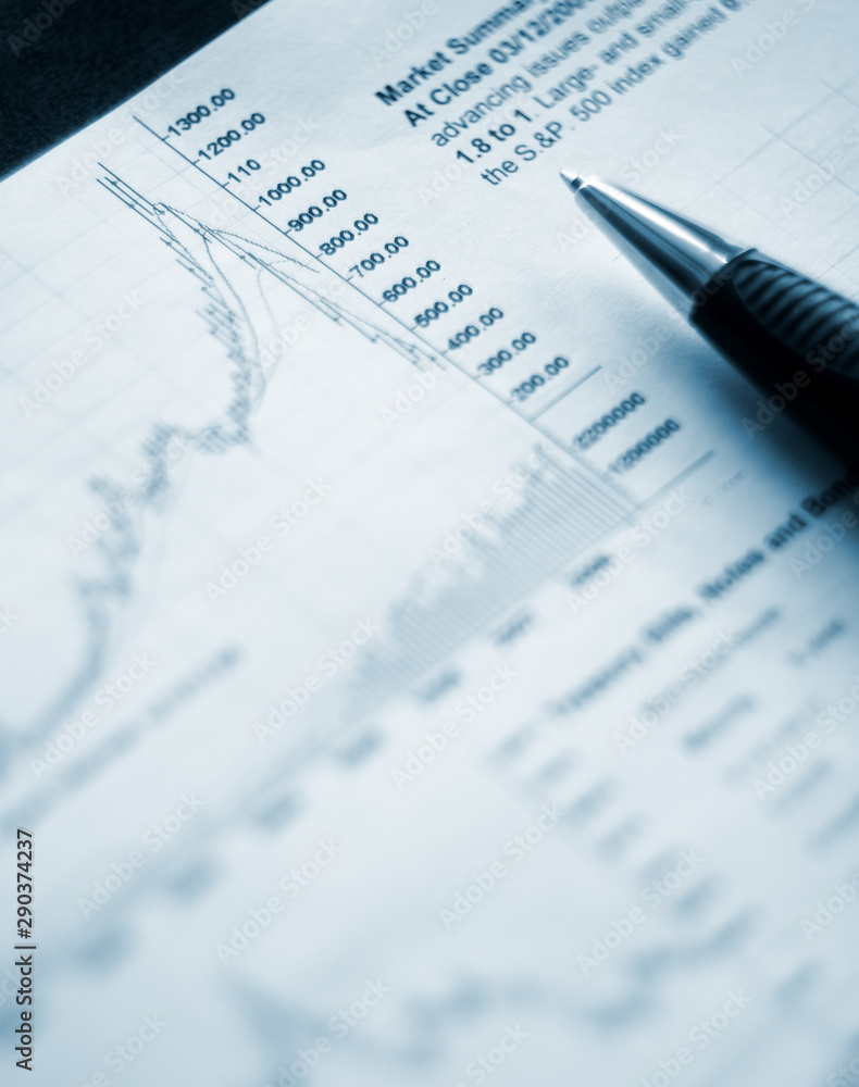 Closeup of a pen near the graph, selective focus