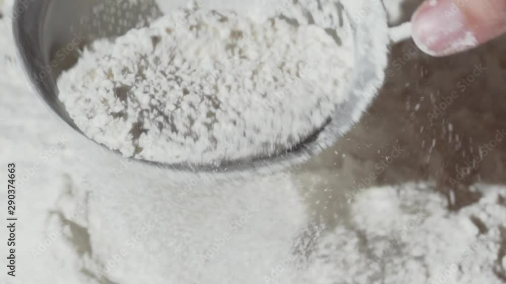 sifting flour through force, slow motion sifting flour through force, slow motion