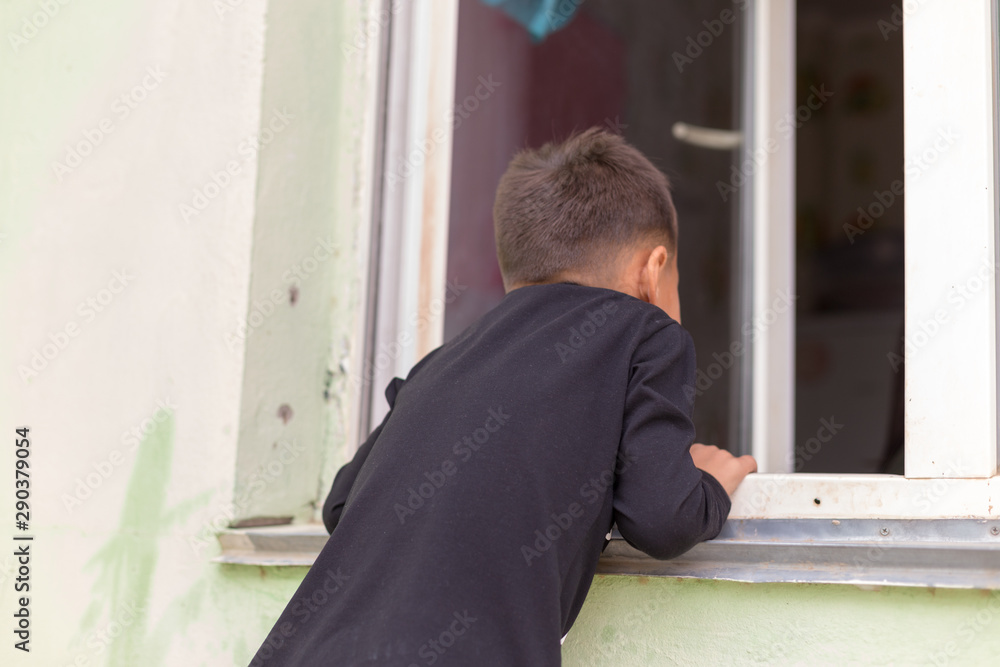 children crawl out the window from the street wants to get home children crawl out the window from the street wants to get home