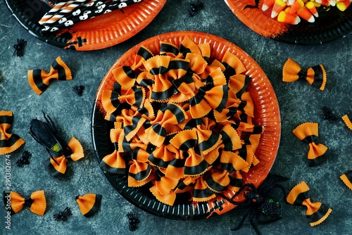 Raw Pasta farfalle for Halloween party. Halloween background. Top view. 