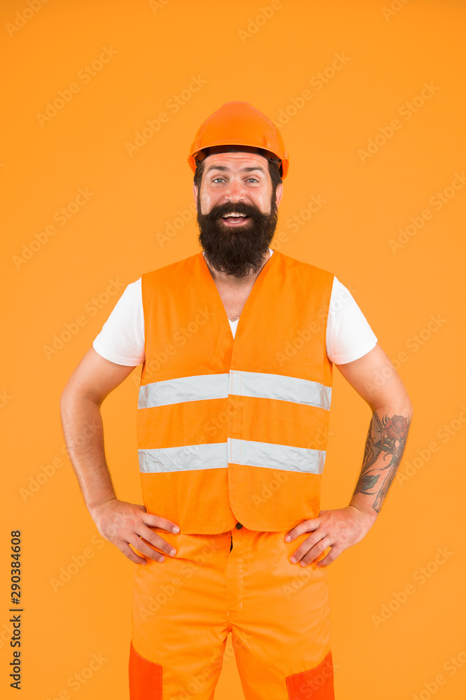 Skilled professional. Happy professional worker on orange background. Constructing engineer or architect wearing professional uniform. Being ready for professional activity Skilled professional. Happy professional worker on orange background. Constructing engineer or architect wearing professional uniform. Being ready for professional activity