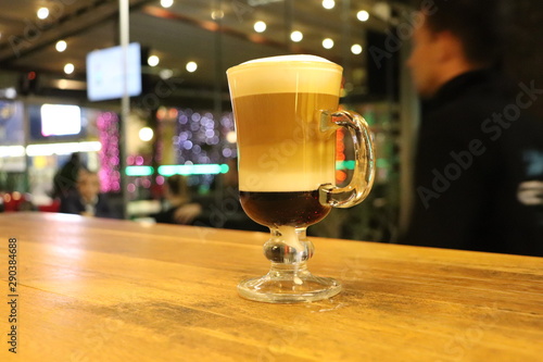 glass of beer on table at bar