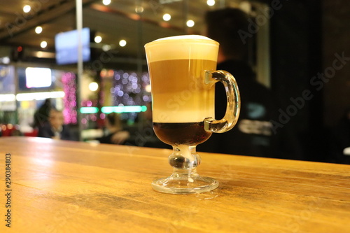 glass of beer on wooden table