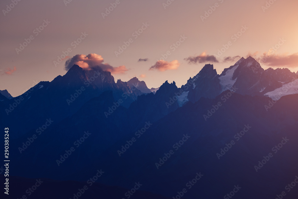 A look at the grand ridge at twilight. Location Upper Svaneti, Georgia country, Europe. Main Caucasian ridge.