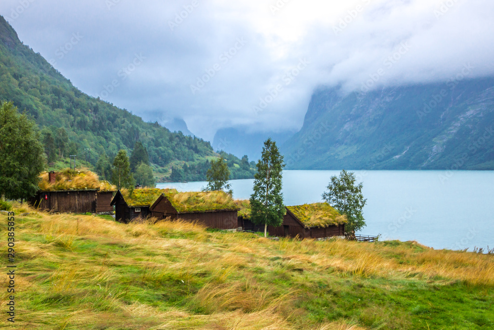 Obraz premium old farm on Lovatnet lake in Norway