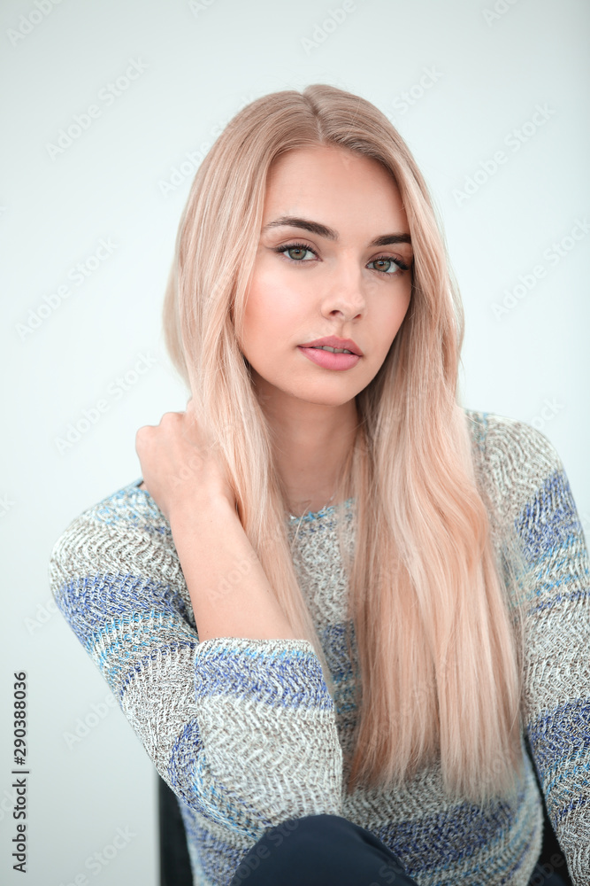 close up. stylish young business woman sitting on a chair close up. stylish young business woman sitting on a chair