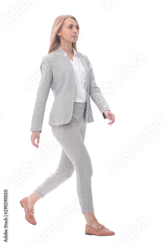 serious young businesswoman stepping forward.isolated on white