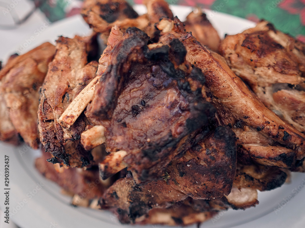 pork ribs golden brown over the grill on a table pork ribs golden brown over the grill on a table