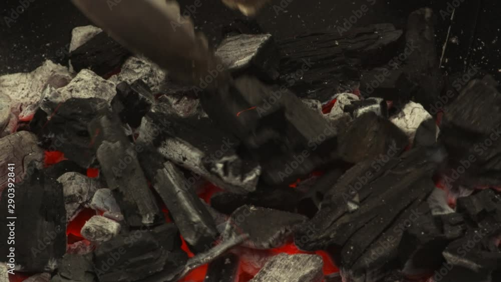Tilt up, smoldering wood embers in grill Tilt up, smoldering wood embers in grill