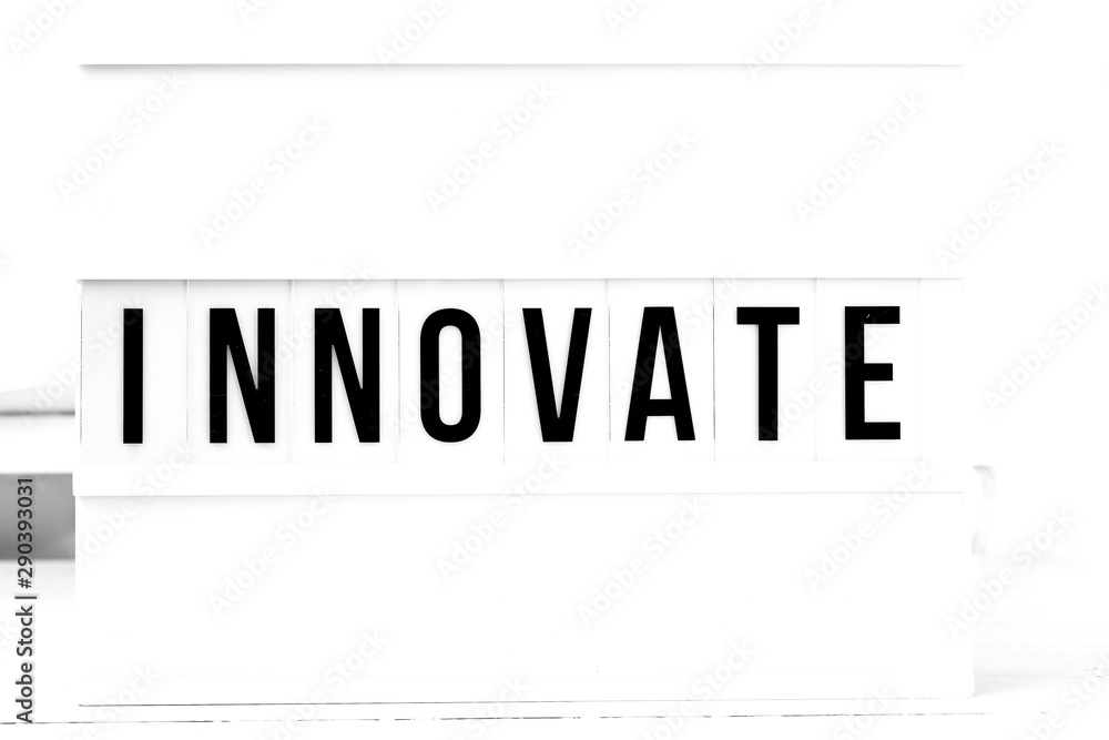 Innovate flat lay on a wooden white background. Motivational business start up board Innovate flat lay on a wooden white background. Motivational business start up board