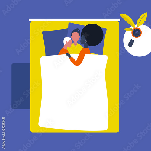 A group of young people cuddling in bed