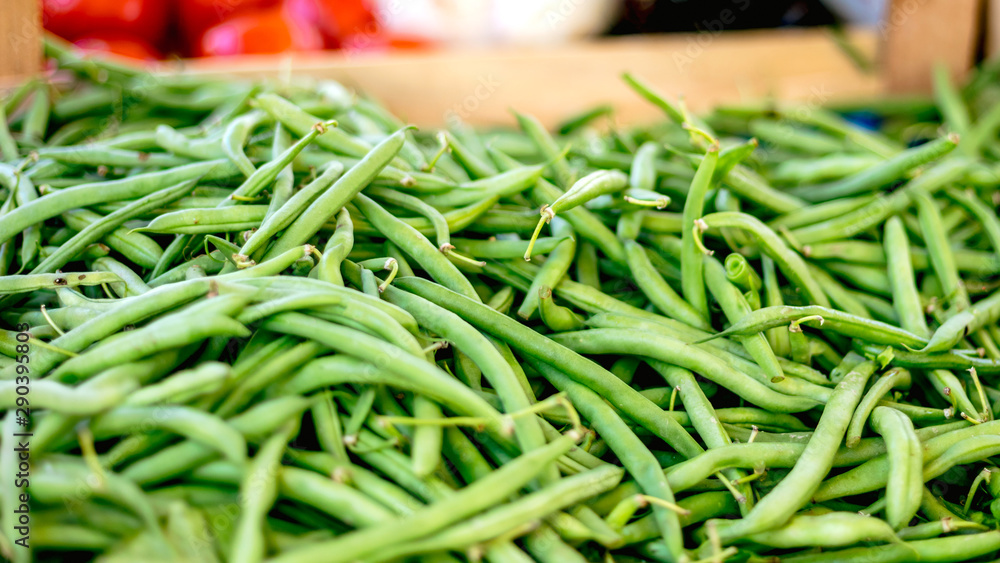 Fresh green pea pods at the morning vegetable farmer's market Fresh green pea pods at the morning vegetable farmer's market