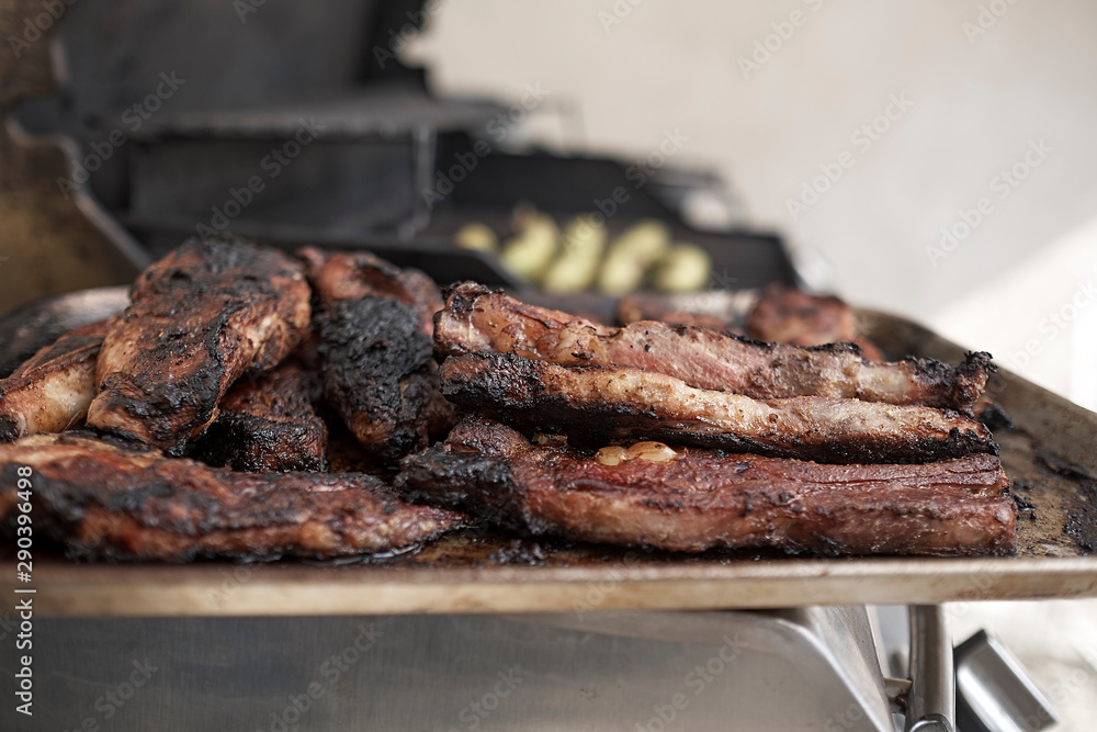 pork ribs golden brown over the grill on a table pork ribs golden brown over the grill on a table