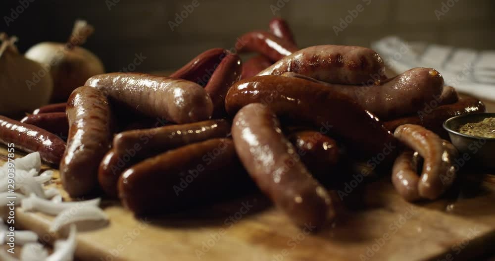 Close up, sausage on cutting board pull focus Close up, sausage on cutting board pull focus