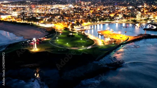 night view of lighthouse and seaport