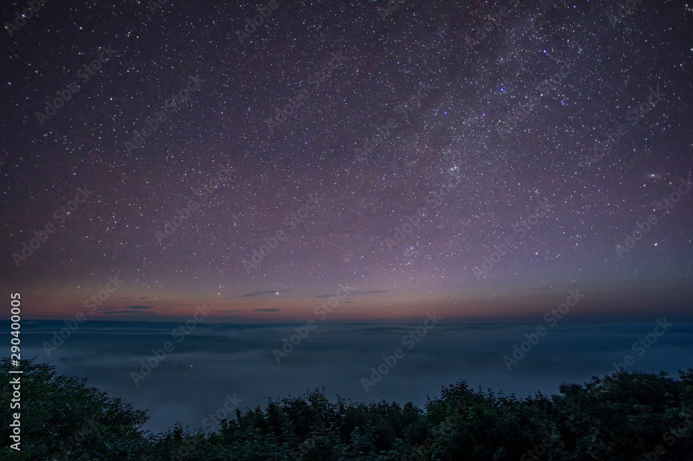 Stars in the predawn sky and fog Stars in the predawn sky and fog