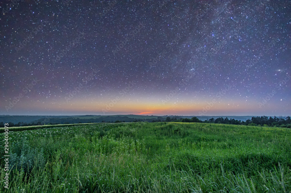 Stars in the predawn sky and fog