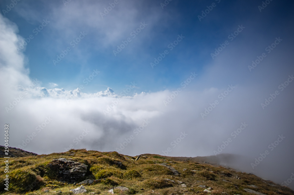 Mountains on a summer day in the fog