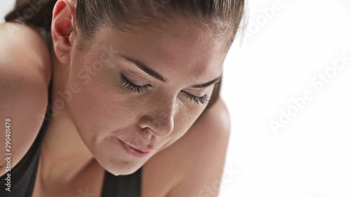Athletic caucasian woman sweating and resting