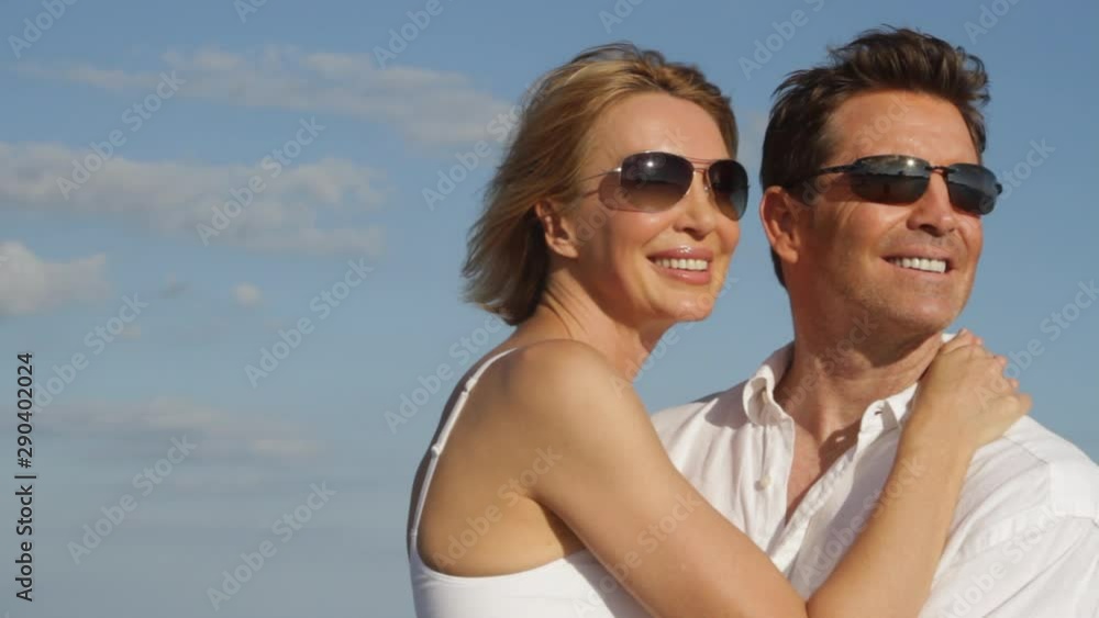 Close up of Caucasian couple with sun glasses kissing Close up of Caucasian couple with sun glasses kissing