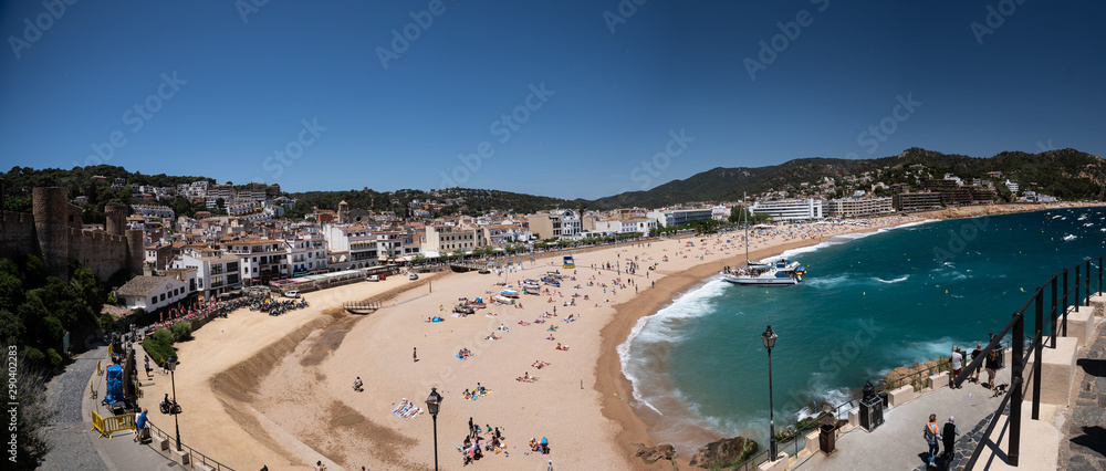 Tourists relax on the beach. General plan