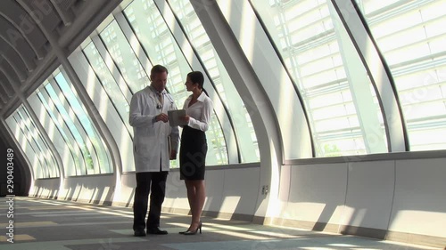 Wallpaper Mural Caucasian doctor and administrator discussing tablet and x-ray Torontodigital.ca