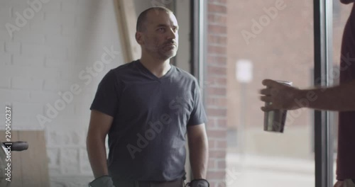 Caucasian construction workers shaking hands