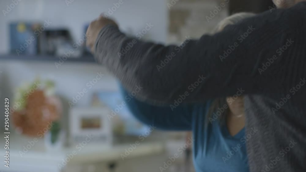 Black couple dancing in living room Black couple dancing in living room