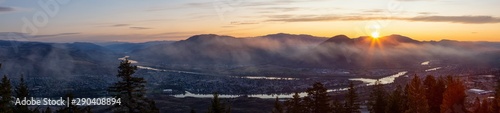 Beautiful Panoramic View of a Canadian City, Kamloops, during a colorful summer sunrise. Located in the Interior British Columbia, Canada.