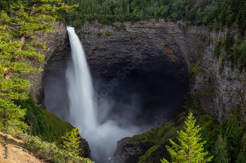 Beautiful View of a waterfall, Helmcken Falls, in the Canadian Mountain Landscape during a sunny and cloudy day. Taken in Wells Gray Provincial Park, near Clearwater, BC, Canada.