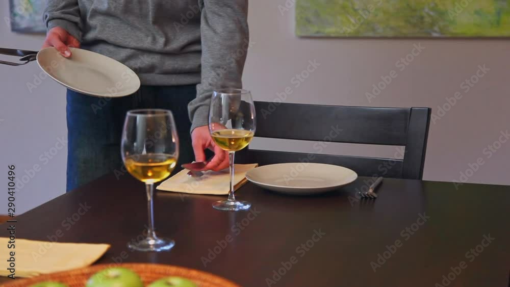 Caucasian couple sitting for dinner and toasting with wine Caucasian couple sitting for dinner and toasting with wine