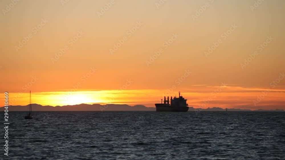 Freighter in English Bay during sunset, Vancouver, British Columbia, Canada Freighter in English Bay during sunset, Vancouver, British Columbia, Canada