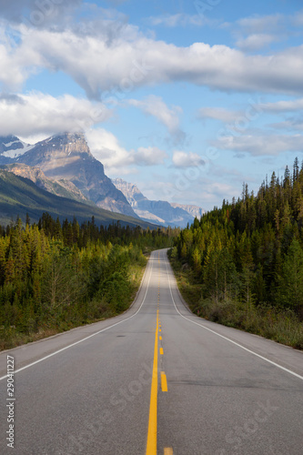 Scenic road in the Canadian Rockies during a vibrant sunny and cloudy summer morning. Taken in Icefields Parkway, Banff National Park, Alberta, Canada. © edb3_16