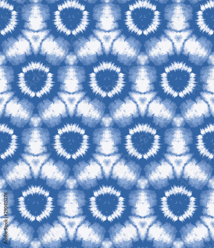 Blurry shibori sunburst tie dye background. Seamless pattern irregular circle on bleached resist white background. Japanese style dip dyed batik textile. Variegated textured trendy fashion swatch