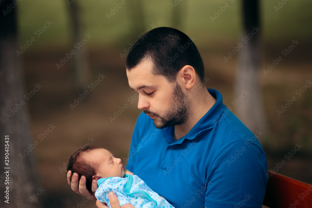 Portrait of a Happy Father Holding Newborn Baby Portrait of a Happy Father Holding Newborn Baby