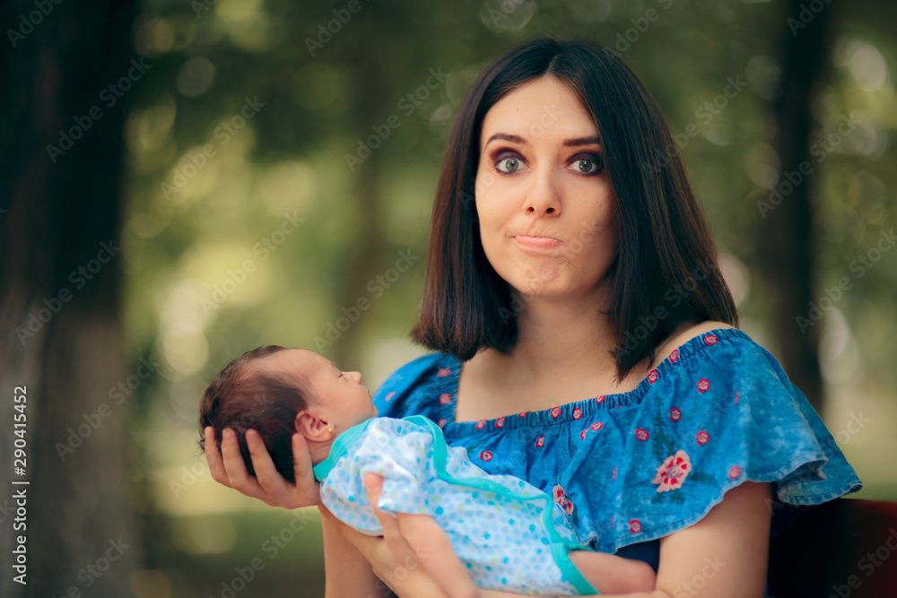 Stressed Mother Holding Newborn Baby in Her Arms Stressed Mother Holding Newborn Baby in Her Arms