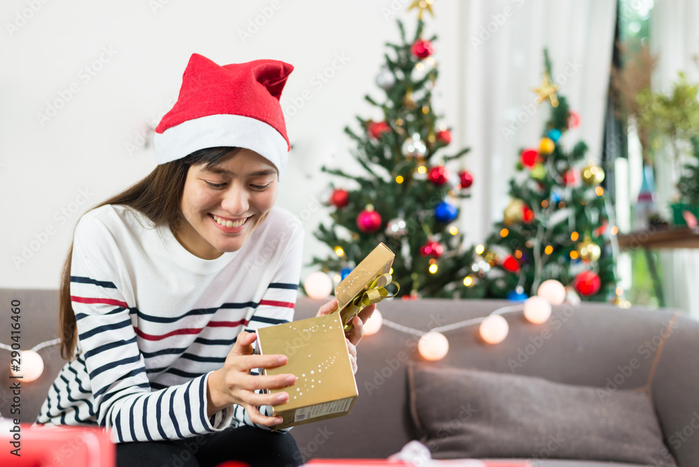 Young asian women holding gift boxes, Christmas.