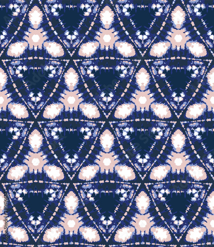 Blurry shibori tie dye triangle diamond background. Seamless pattern indigo coral bleached resist background. Japanese style irregular dip dyed batik textile. Variegated textured trendy fashion swatch