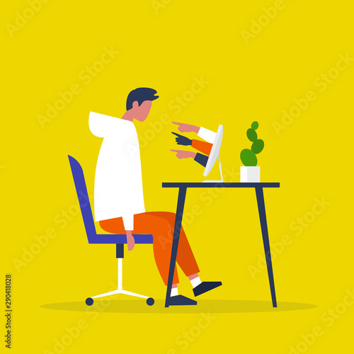 A victim of cyberbullying sitting at the computer