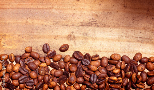 Coffee beans on wooden background