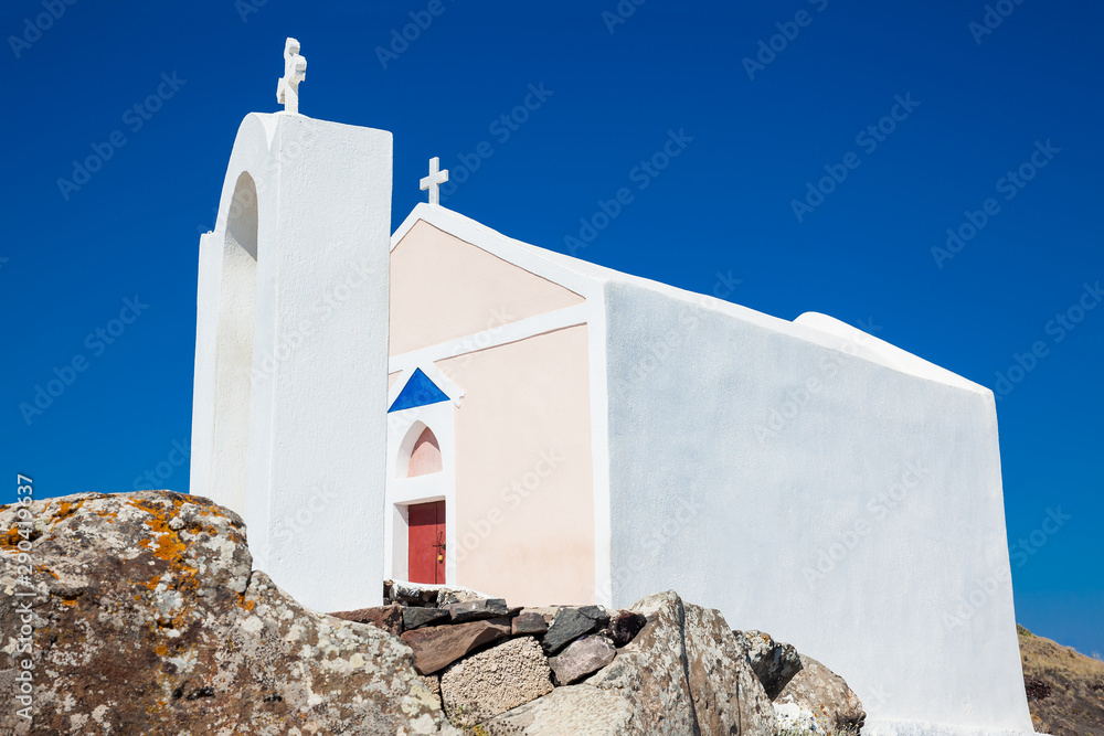 Beautiful small church next to the walking path between Fira and Oia in Santorini Island