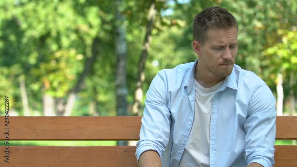Frustrated man holding girlfriend hand asking her to stay, break-up, lovelorn Frustrated man holding girlfriend hand asking her to stay, break-up, lovelorn