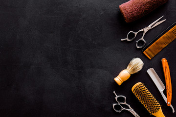Barbershop concept. Hairdressing tools on black background top view space for text